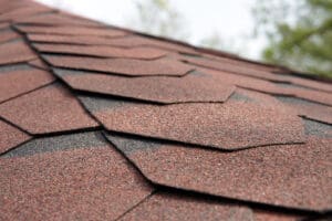 Close up view on asphalt roofing shingles .