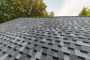 new renovated roof covered with shingles flat polymeric roof-til