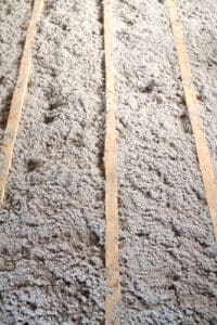cellulose insulation between the beams in an attic