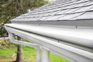 New, seamless gutters with gutter guards on a home