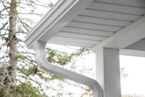 Underside view of white, seamless gutters on a home
