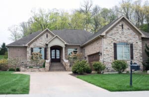 Beautiful new, stone home with shingle roofing