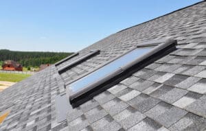 Roof with light shingles and skylights