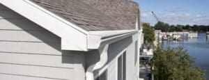 White rain gutter with downspout