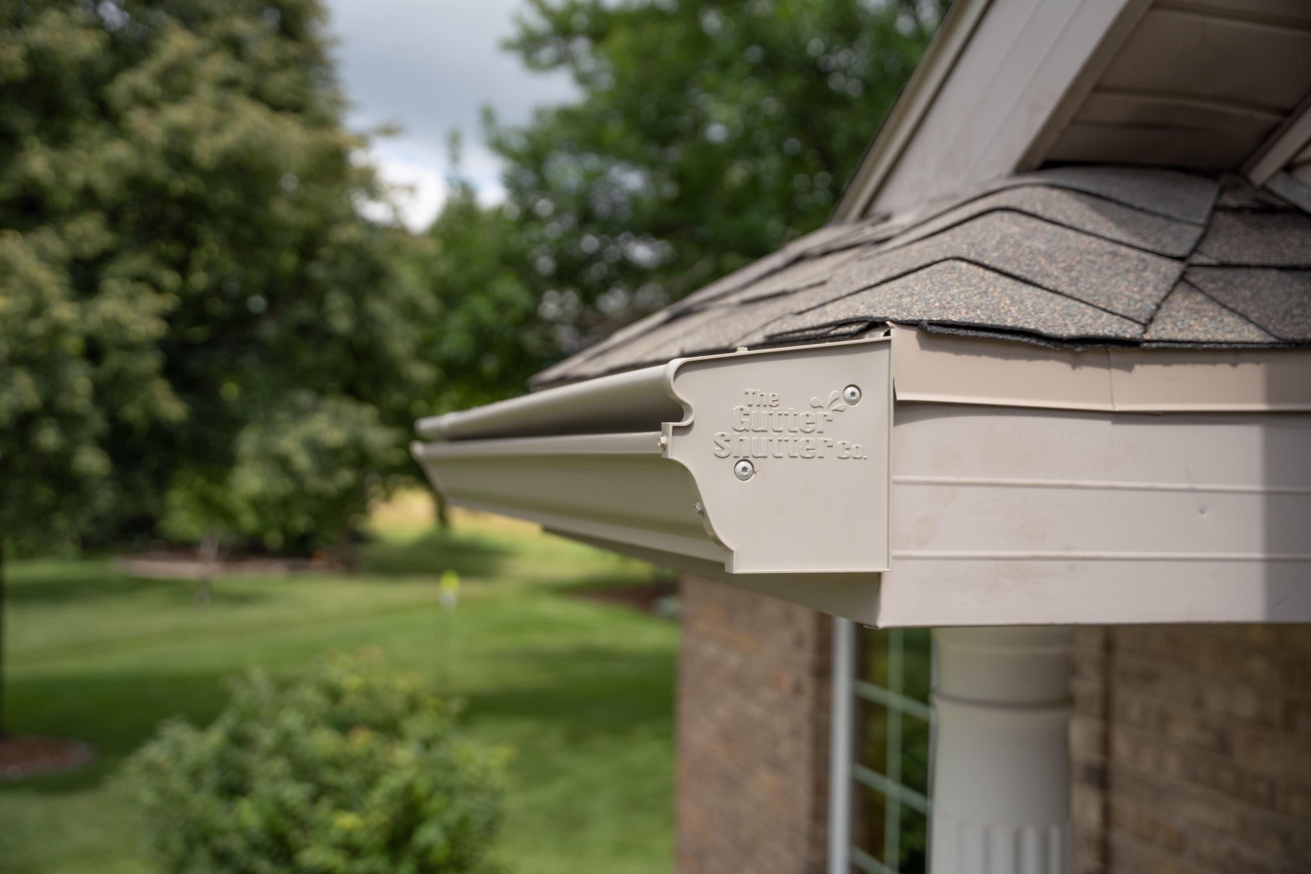brown GutterShutter gutter on a house